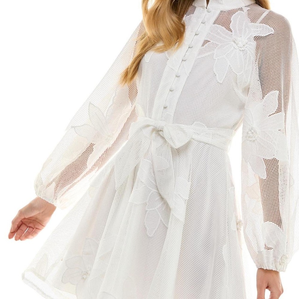White floral mini‎ dress with long sleeves and tie waist.